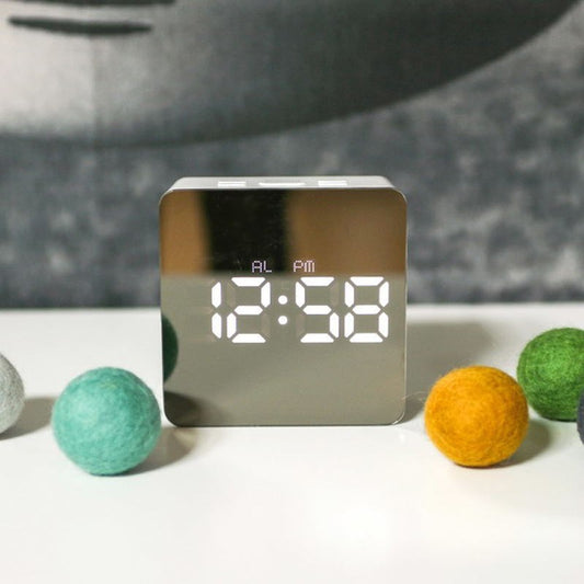 LED mirror alarm clock displayed on a modern bedside table
