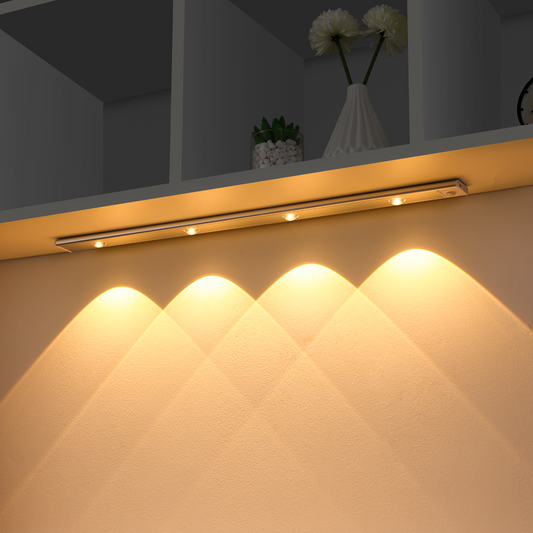 Under-cabinet lighting fixture on a kitchen counter with a soft glow.